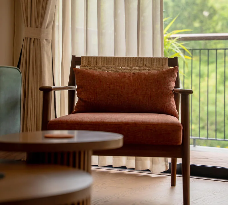 An armchair by the window in a room at Avera